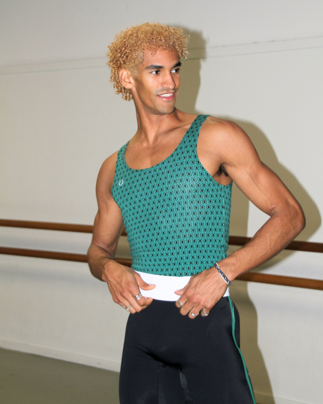 Davi Ramos wearing GENTS forest green print singlet in the studio