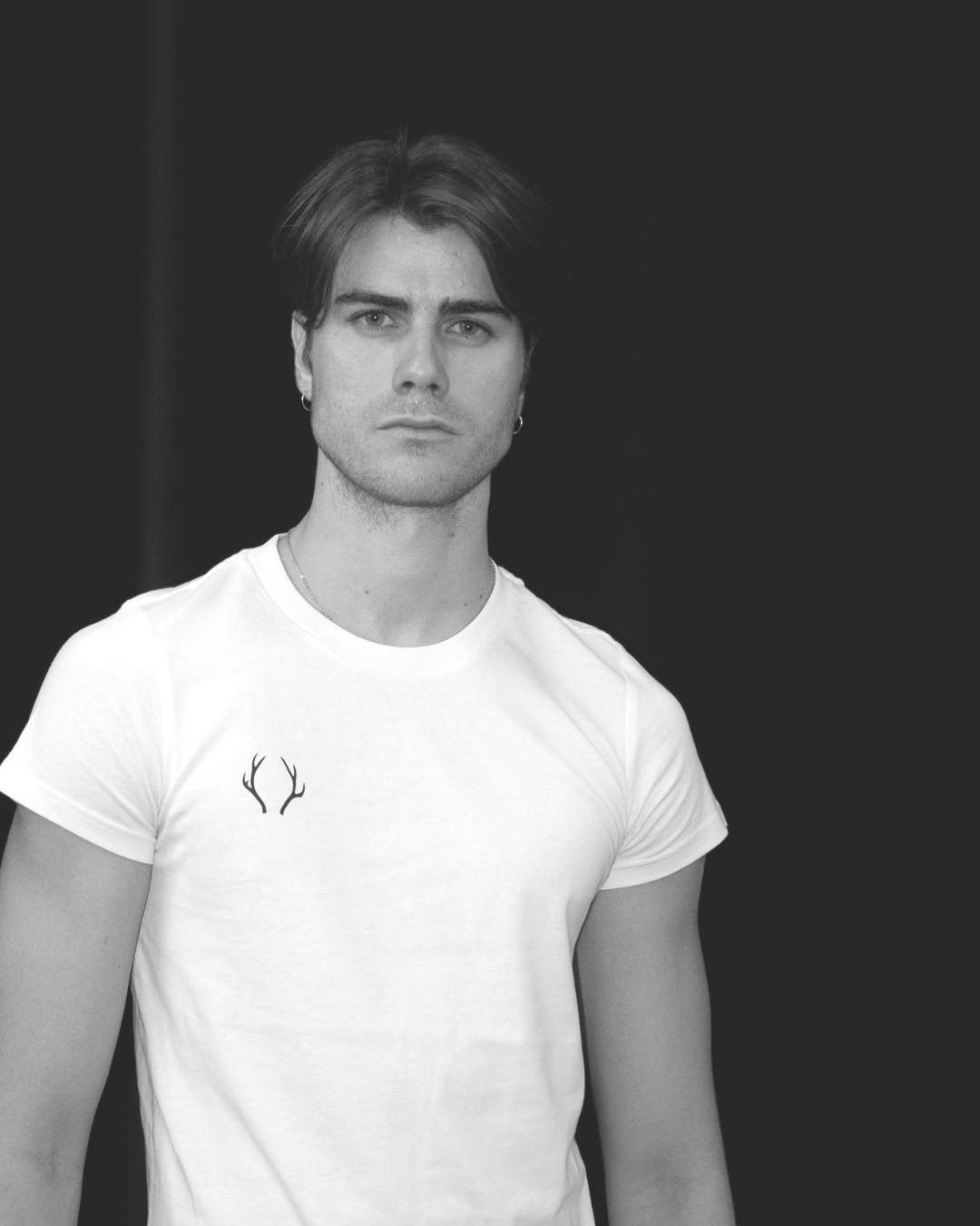Male dancer wearing white GENTS tee, front view